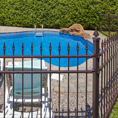 Wrought iron fence around a pool.